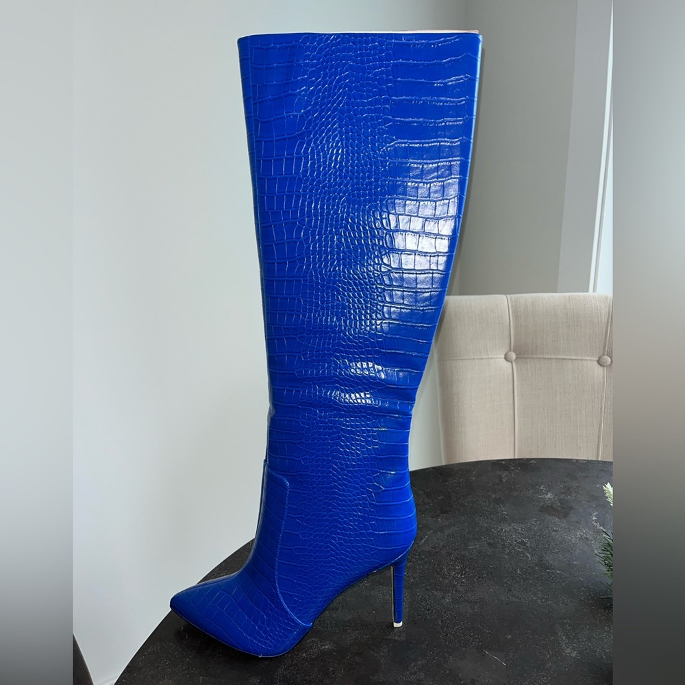 A pair of new never worn Nine West Taler boots in blue crocodile